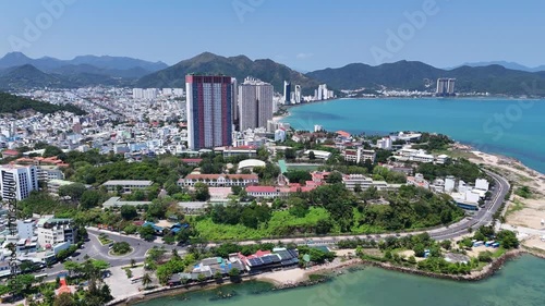 Aerial panoramic view of Northern part of Nha Trang city with sandy beach and mountains, Vietnam.