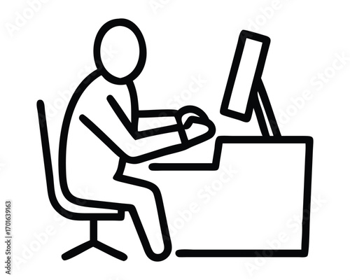 A businessperson works on a laptop at their desk