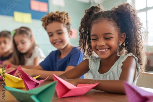 Students making paper boats and flags in classroom for Columbus Day holiday