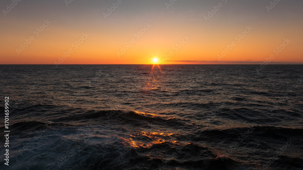 Obraz premium Sunset and Blue Hour at sea, over the Atlantic Ocean, August 2025.