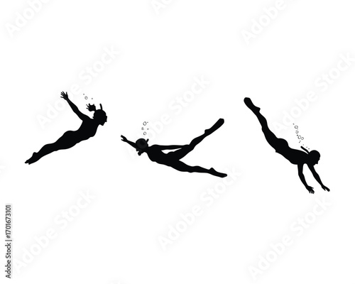 Silhouettes of three female divers in graceful poses plunging downwards in clear blue water with bubbles
