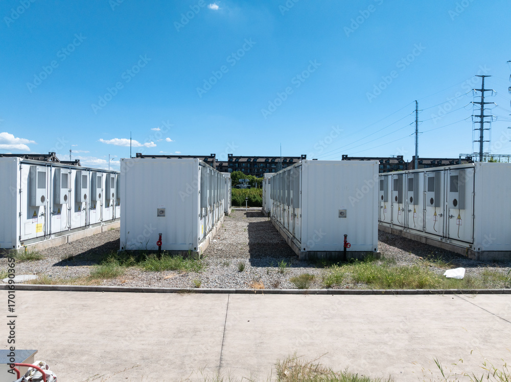 Fototapeta premium Aerial view of battery energy storage systems under a clear blue sky