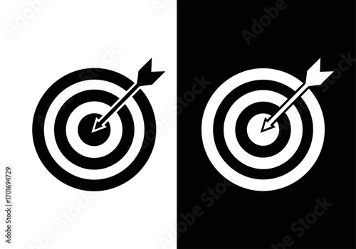 Aiming for Excellence: A striking minimalist image of a target, bisected by black and white, with an arrow precisely centered in the bullseye, symbolizing precision and focus.