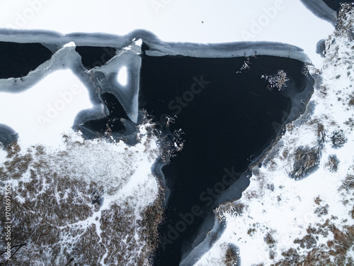 Aerial view of snowy forest...