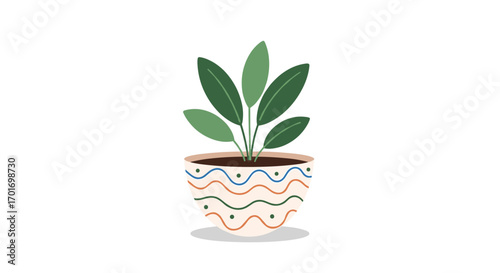 A beautifully decorated ceramic pot holds a lush green plant with large leaves sitting in dark soil on a white background with a light grey shadow