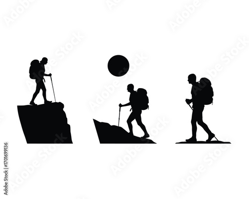 Silhouette of a hiker with a backpack and trekking poles walking on a rocky mountain trail against a bright sky