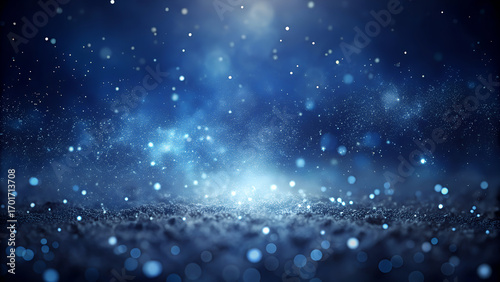 Magical sparkling particles cascade across dark blue abstract background