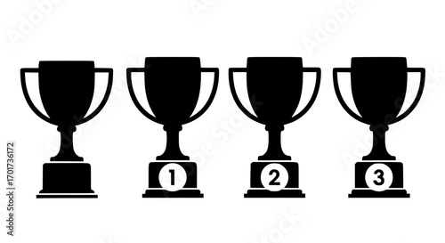 Silhouette of four trophies celebrating victory achievement and competition success
