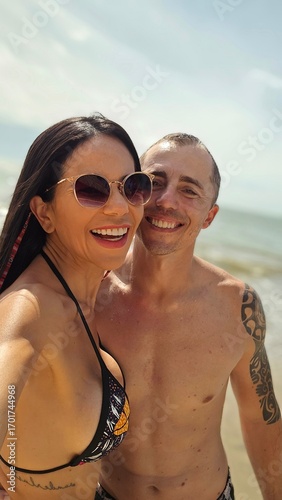 young couple happy on the beach