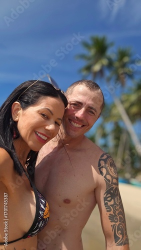 happy young couple on the beach