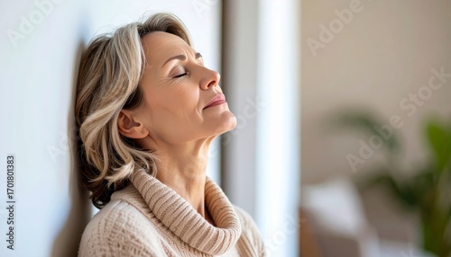 Free Download Mature Woman Leaning Against Wall, Eyes Closed in Contemplation - GFXLoad