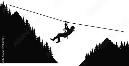 Silhouette of a person riding a zip line between two mountains extreme sport and adventure activity in nature