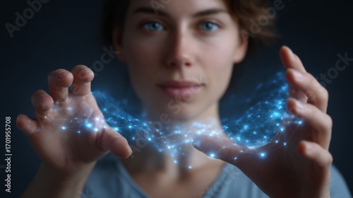 Wallpaper Mural Empowering Discovery: A woman's hands delicately cradle an ethereal field of blue glowing particles, embodying the boundless potential of exploration and unveiling the secrets of the universe. Torontodigital.ca