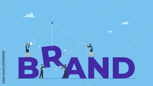 Business people help building the word BRAND. Build branding create brand awareness advertising, product or company value strategy, build reputation or identity for customer recognition.