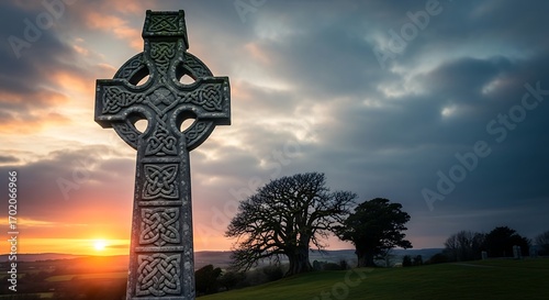 Ancient Celtic Cross at Sunset with Dramatic Sky.