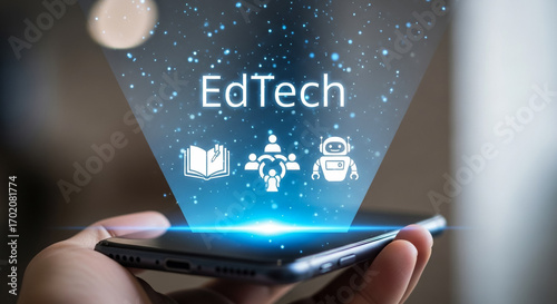 EdTech Innovation: A close-up shot reveals a hand holding a sleek smartphone, projecting a vibrant display of educational technology concepts, representing the future of learning and development.