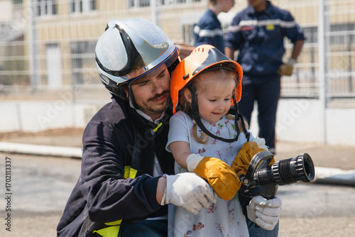 Father teaches his daughter Firefighter