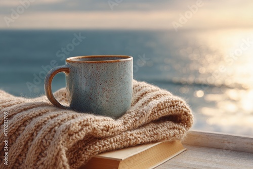 Cozy Coffee Mug On Knitted Blanket By Book With Ocean View