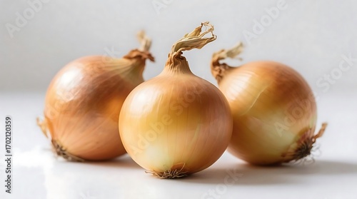 Wallpaper Mural Three Fresh Yellow Onions with Papery Skins on a Light Background Torontodigital.ca