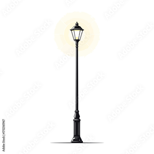 Elegant black street lamp with a bright yellow glow, casting a shadow on the ground.
