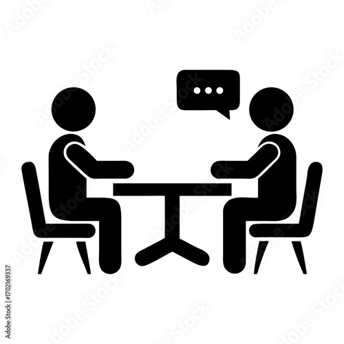 Two people at the table glyph icon simple solid. Simple black and white illustration of two stylized figures seated around a table, with speech bubble suggesting communication.