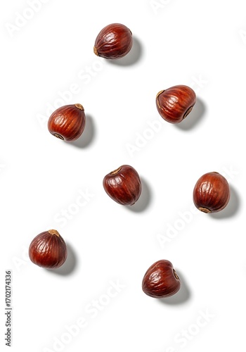 Wallpaper Mural Seven shelled hazelnuts scattered on a white background with shadows. Torontodigital.ca