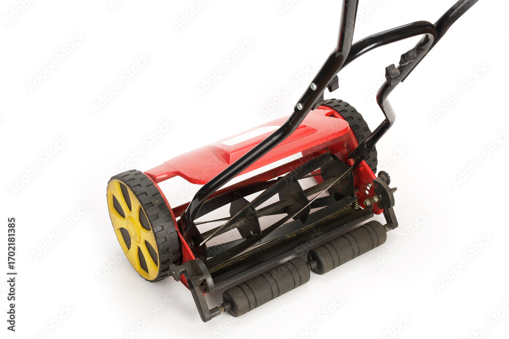 Fototapeta premium Used lawn mower with visible blades on white background