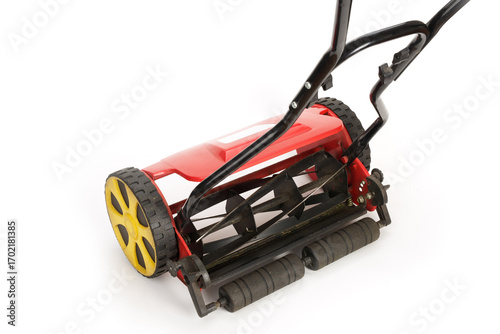 Used lawn mower with visible blades on white background