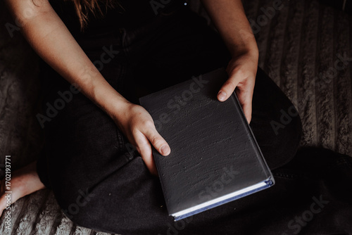 man reading a book on the couch