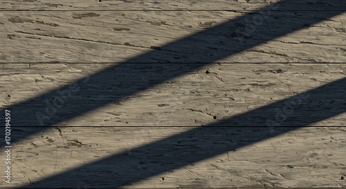 Textured wooden planks with shadows across them