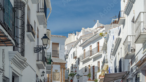 Streets in Frigiliana, typical Andalusian village with white houses, Spain