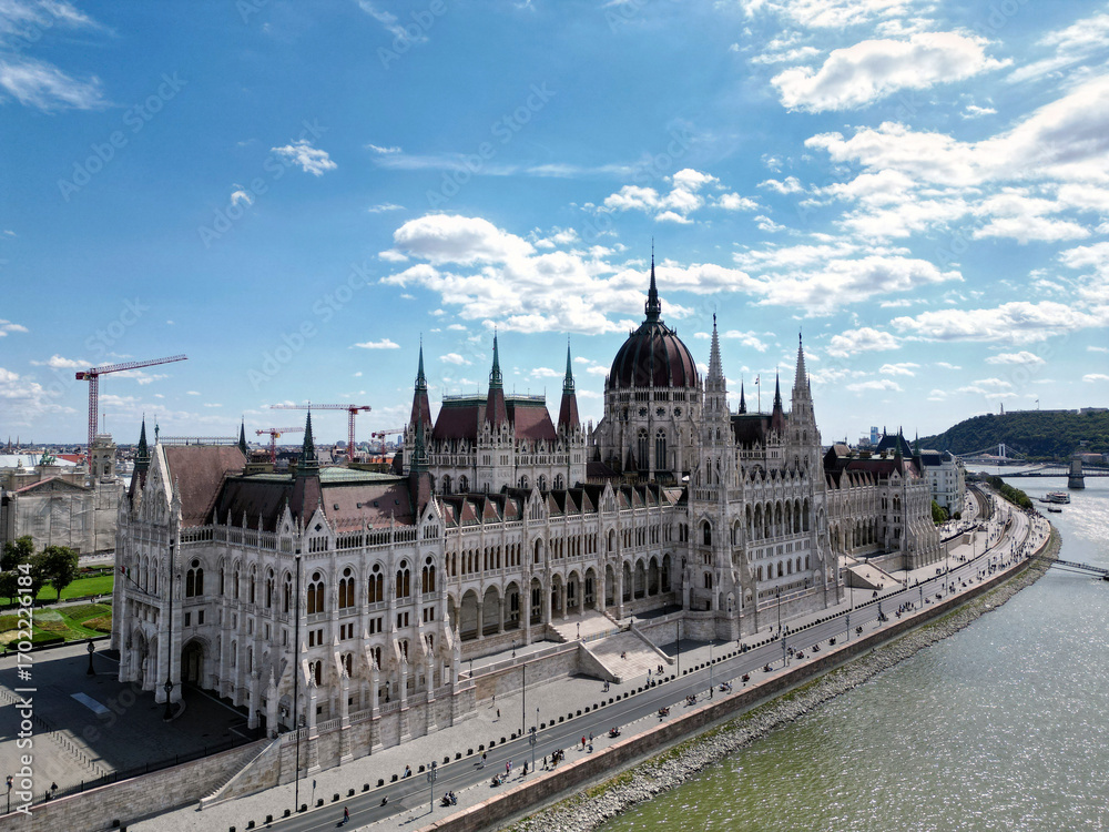 Fototapeta premium Aerial view of Hungarian Parliament Building in Budapest. Hungary Capital Cityscape at daytime. Travel, tourism and European Political Landmark Destination