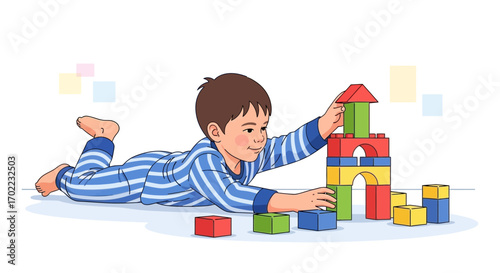 A young boy joyfully building a tower with colorful blocks on a white background