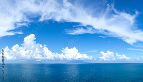 Wide shot of a placid ocean and a vibrant sky