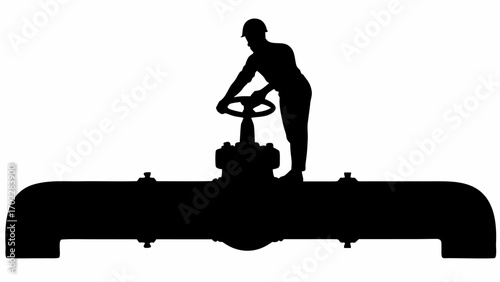 Silhouette of worker turning valve on large pipeline with hardhat in a black and white industrial scene