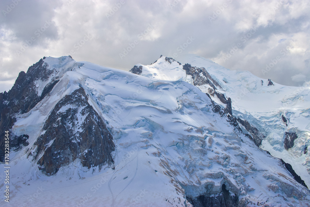 Obraz premium Peak of Mont Blanc covered by clouds view from aiguille du midi in chamonix france