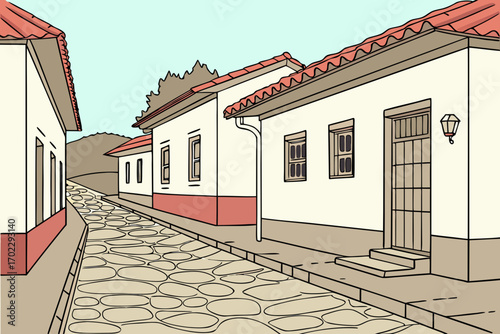 Charming cobblestone street lined with traditional houses and tiled roofs