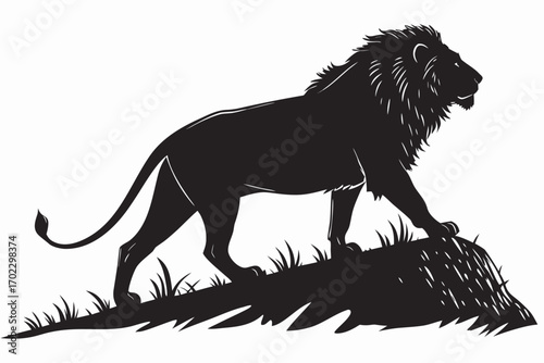Silhouette of a majestic lion standing on a grassy mound