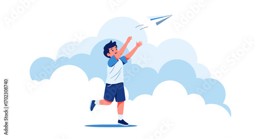 Joyful boy launching a paper airplane into the sky with clouds in the background