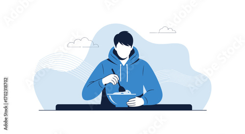 Person In A Blue Hooded Sweatshirt Enjoying A Meal From A Bowl at a Table