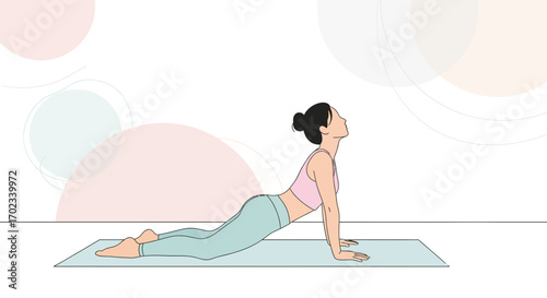 Woman in yoga pose doing upward-facing dog asana, wellness concept, exercise