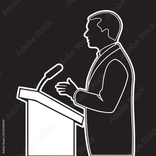 Silhouette of a man speaking at a podium with microphone