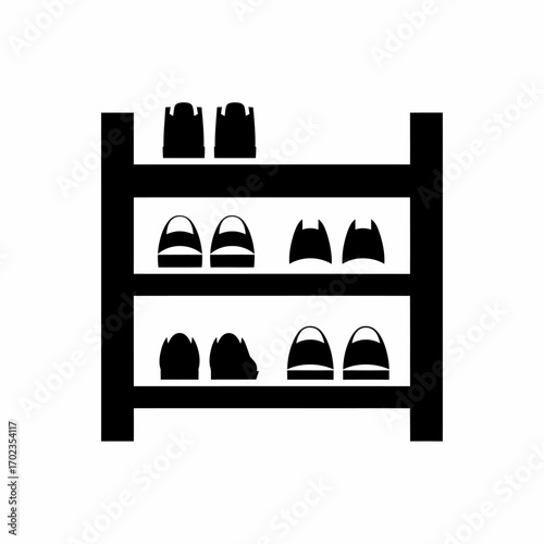 Black silhouette of a shoe rack with three shelves, holding various pairs of shoes, isolated on a white background.