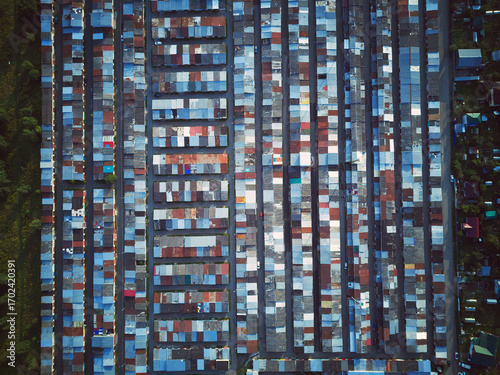 Aerial top view landscape with garage roofs