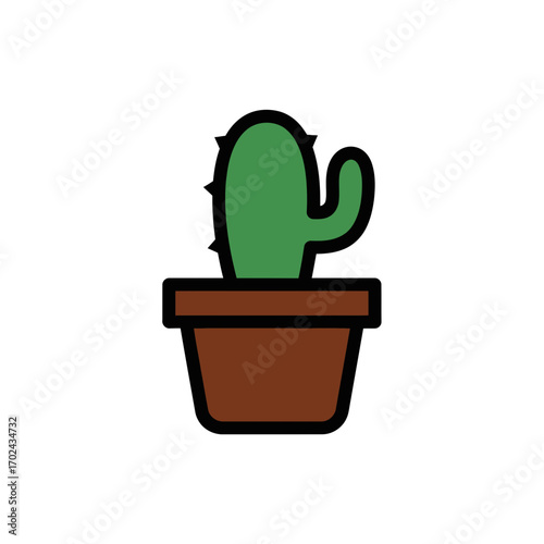 Isolated cactus grows potted indoors against white