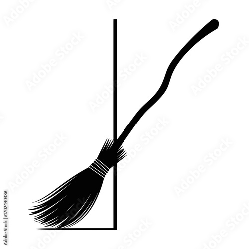 Black witch broom silhouette leaning on a corner isolated on white background