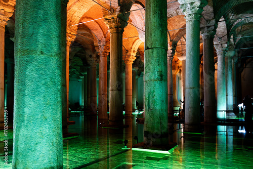 Interior view of the Basilica Cistern with illuminated columns and colorful lights, historic underground landmark in the old city of Istanbul, Turkiye.