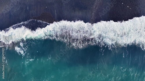 Wallpaper Mural Aerial looking down at waves on a black sand beach in Bali Indonesia. Torontodigital.ca