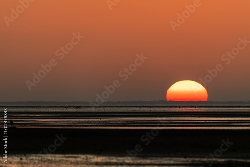 A beautiful view of the setting sun in bay of bengal inside Marine National Park on the outskirts of Jamnagar, Gujarat, India
