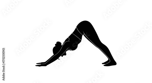Silhouette of a woman performing the Downward-Facing Dog yoga pose.